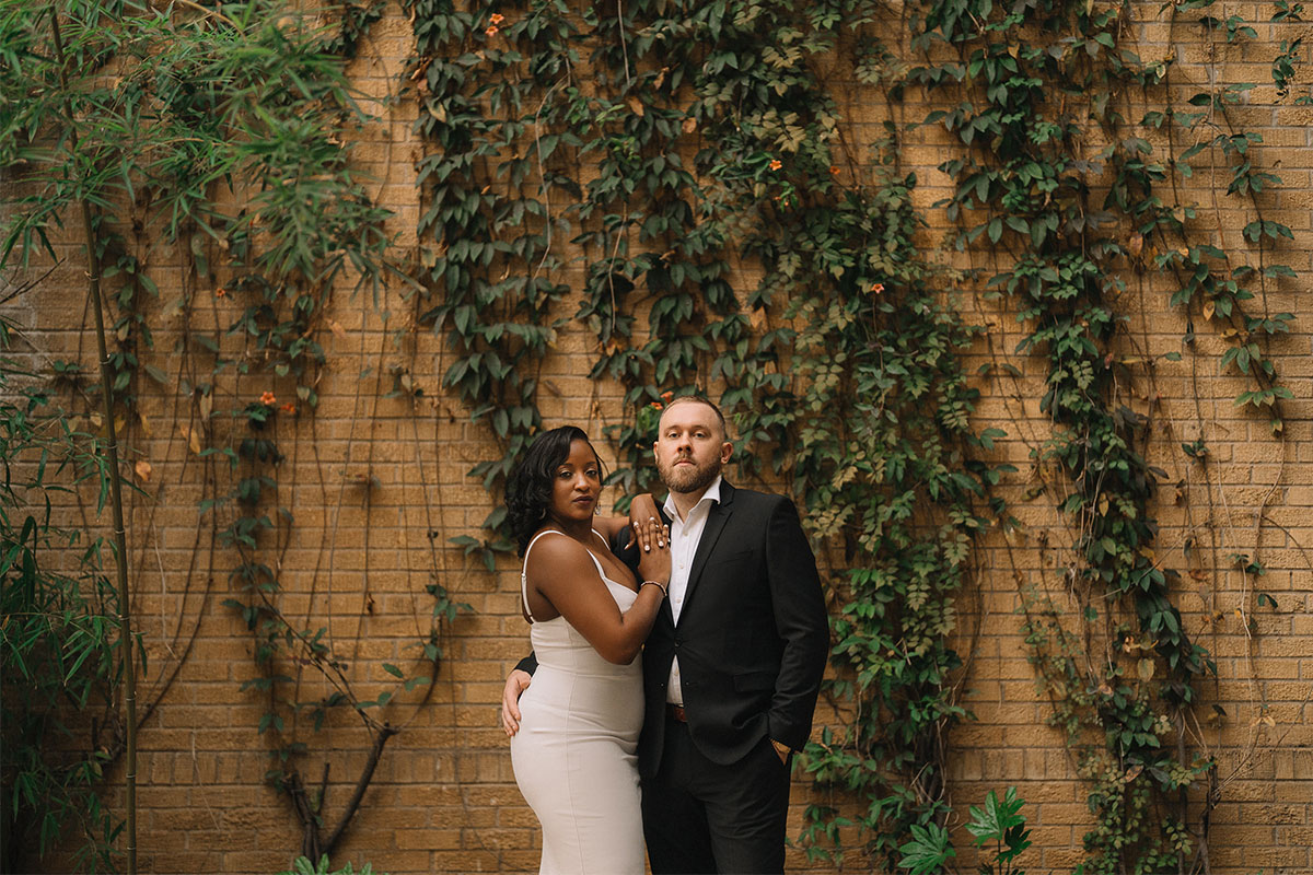 Engaged bi-racial couple having fun around the arts district in Dallas, photographed by Hannah Hix