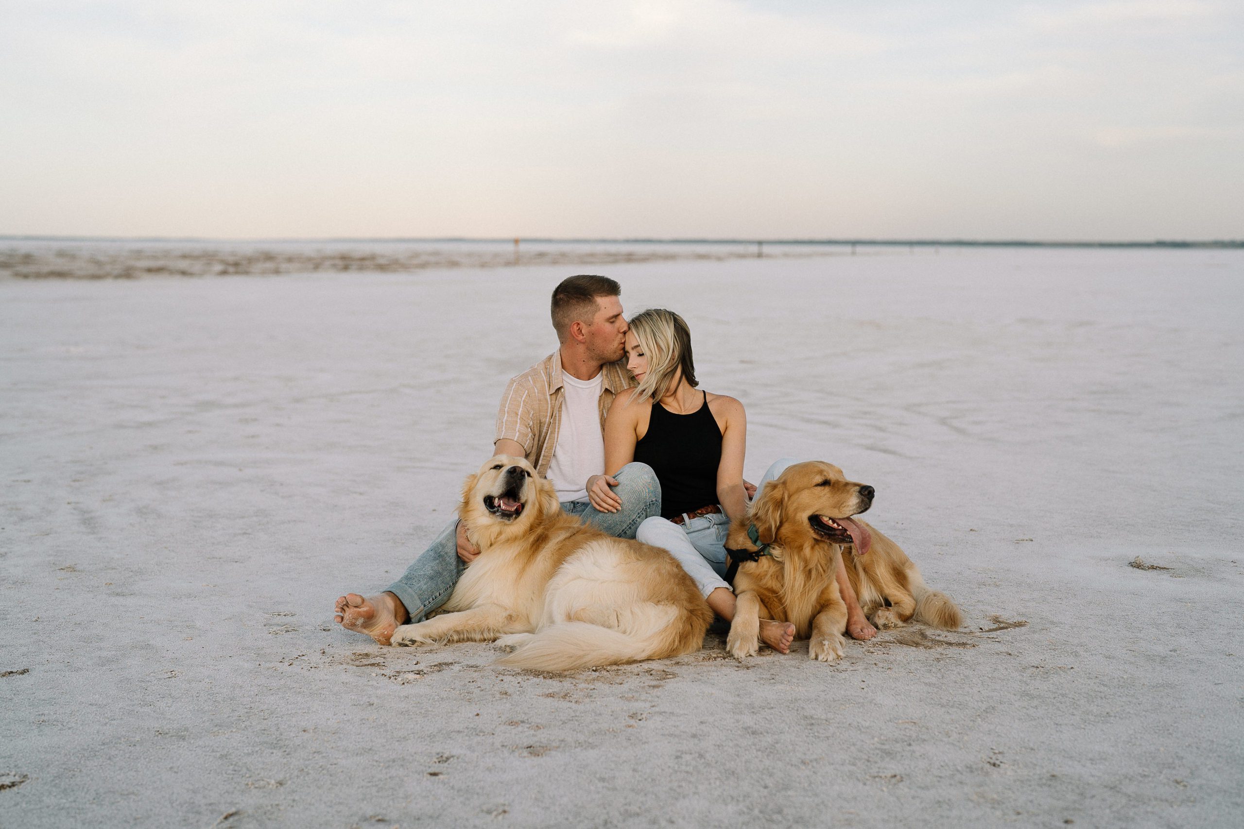 Engaged couple with their dogs at the Oklahoma Salt Plains photographed by Hannah Hix