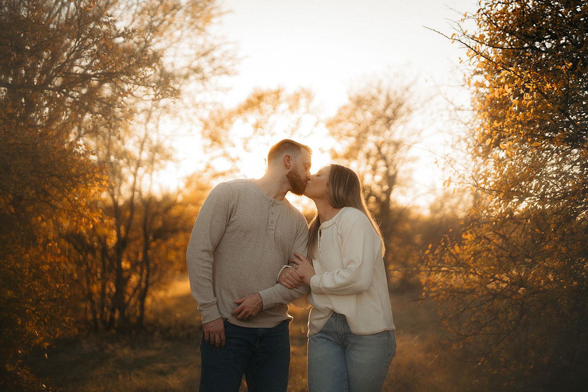 Engaged couple with their dog in the fall at Arbor Hills in Plano photographed by Hannah Hix