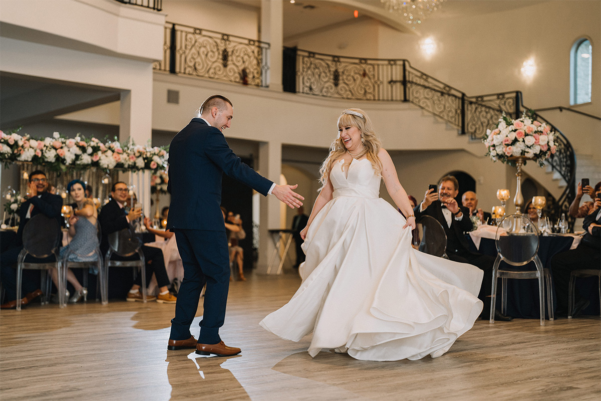 Wedding couple dancing with family at the Olana wedding venue in Texas