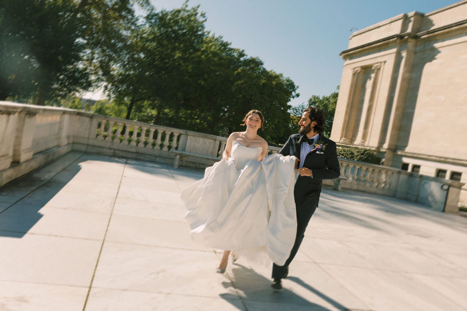 Persian Bride and Groom running freely and laughing joyfully on the marble stairs of the Cleveland Museum of Art
