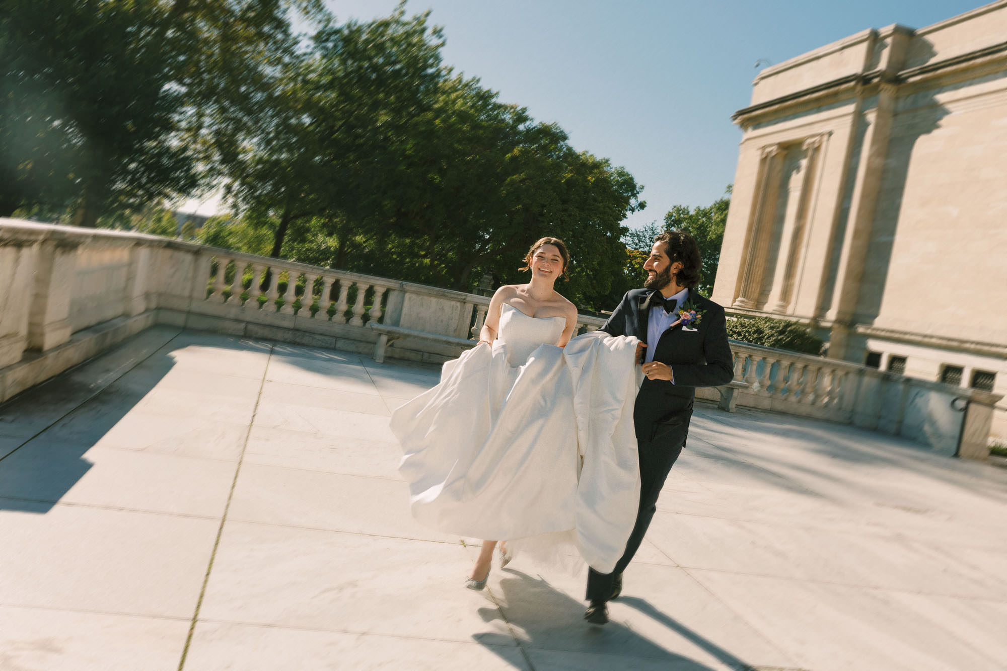 Persian Bride and Groom running freely and laughing joyfully on the marble stairs of the Cleveland Museum of Art